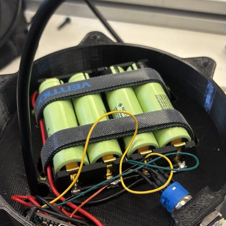 Battery section with four 18650 cells in a holder and the charging module wiring.